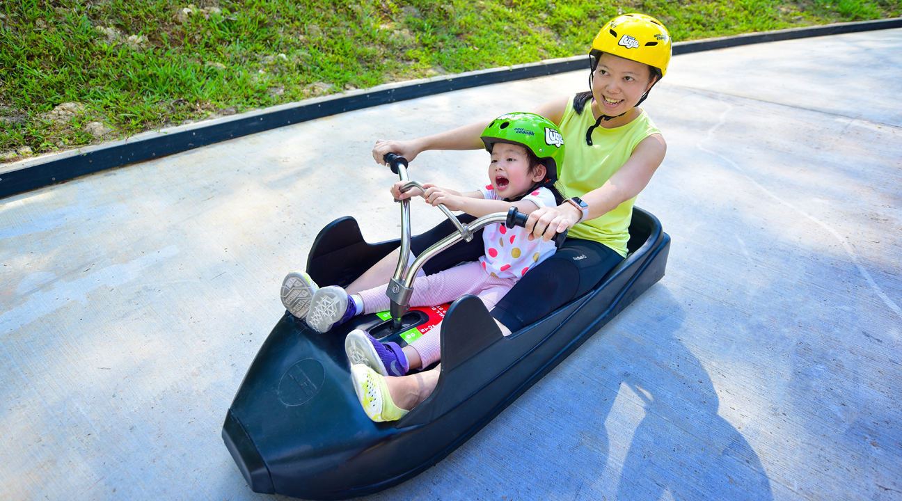 A family car race at Skyline Luge Sentosa