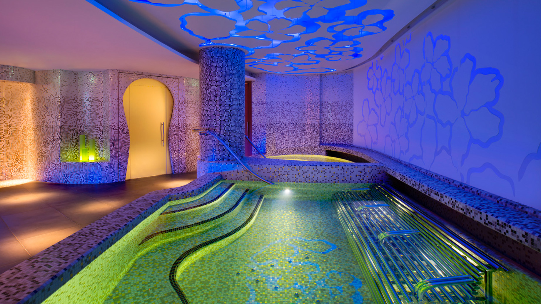 AWAY Spa illuminated with a decompression area, sauna, steam room, whirlpool, pool, herbal bath and experiential showers.