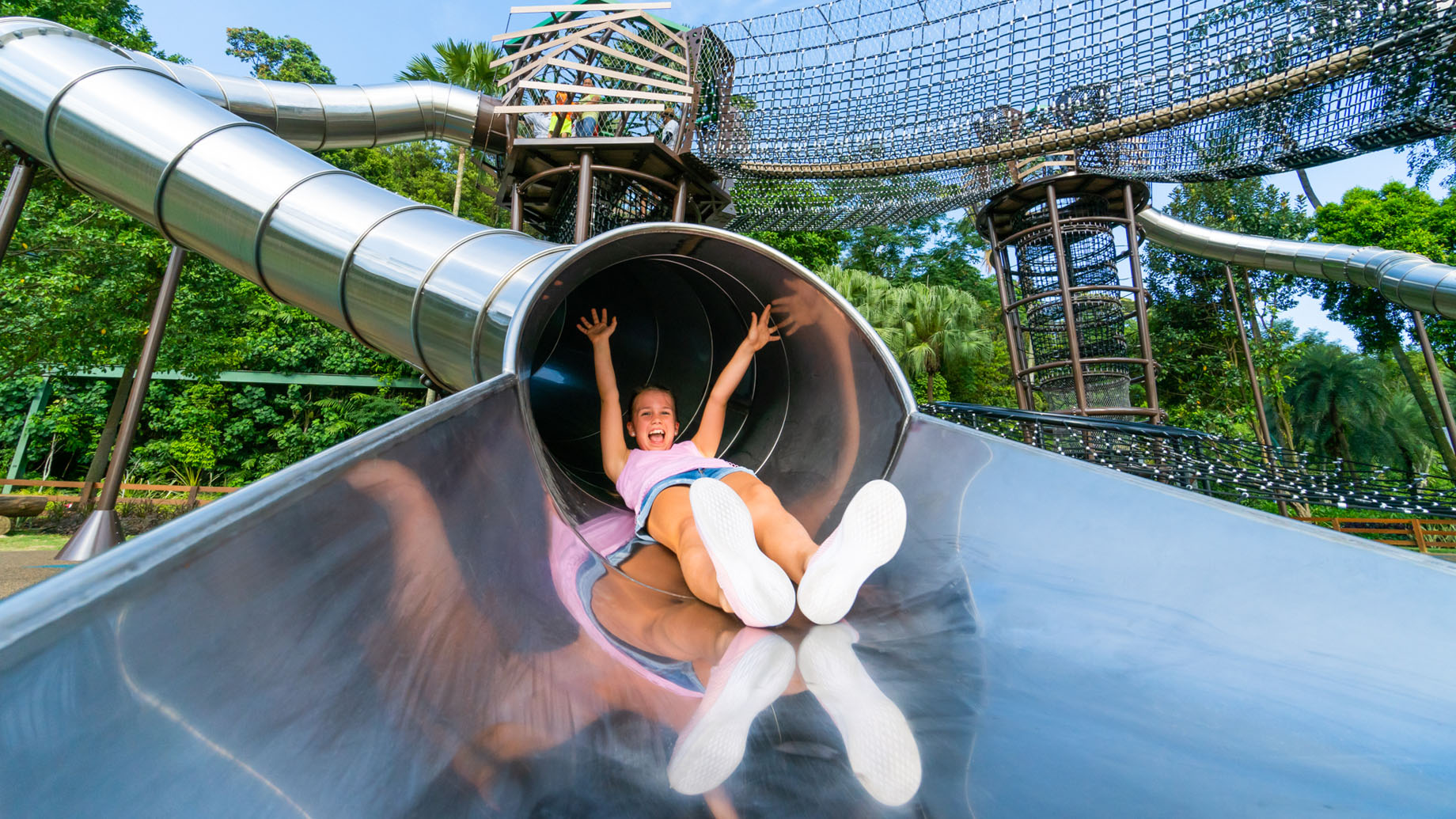 A young girl sliding down a slide in Nestopia