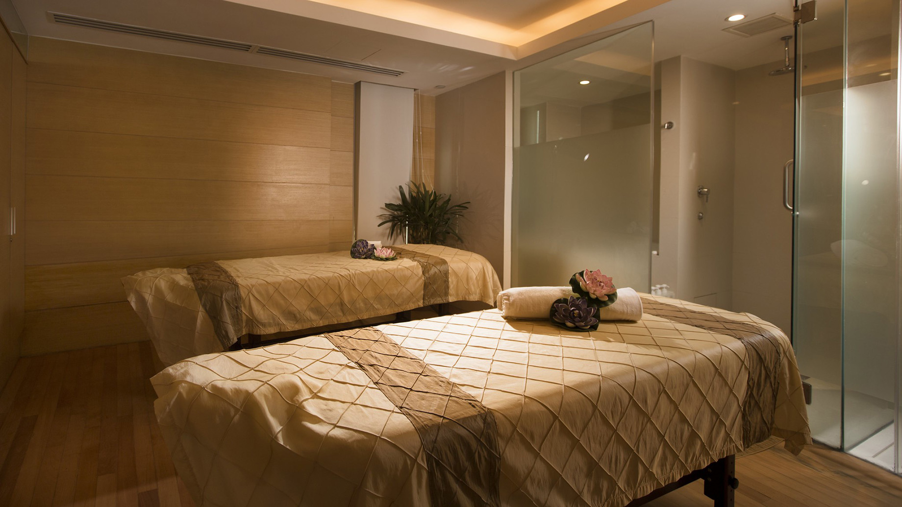 A spacious spa room at CHI, The Spa, that communicates the feeling of soothing relaxation.
